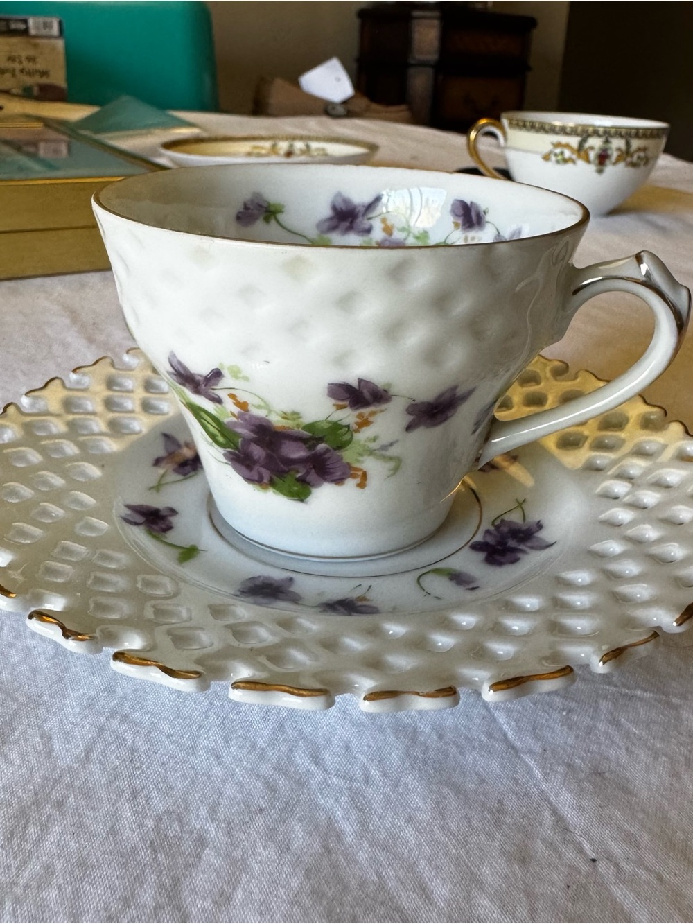 White Porcelain Teacup & Saucer with Purple Floral Design and Gold Trim